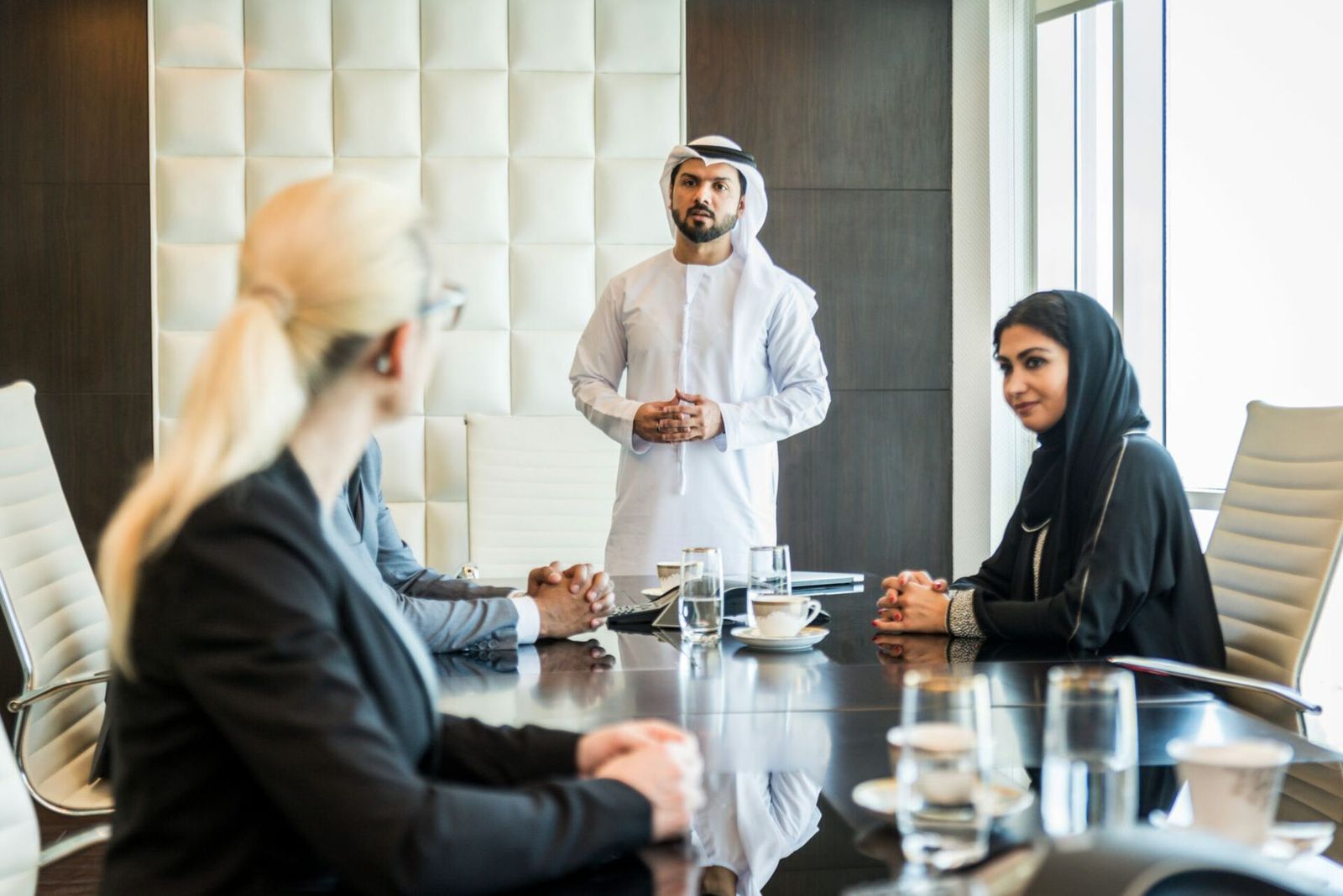 A project meeting around a boardroom table